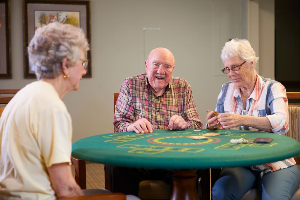 Residents playing cards at Shorewood Senior Living in Florence, Oregon