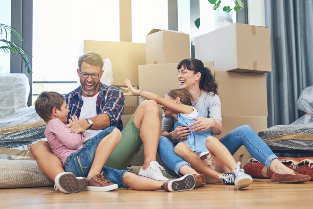 Family moving with boxes from Lockaway Storage in San Antonio, Texas