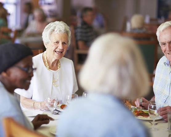 Residents having a delicious meal in the dining room at Randall Residence of Centerville in Centerville, Ohio