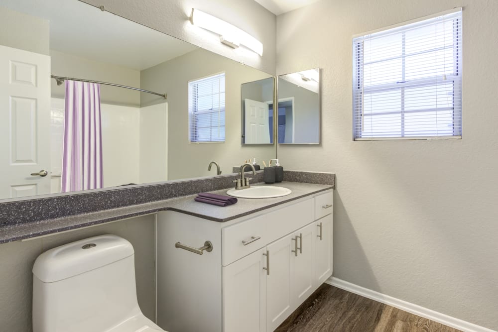 Bathroom with a large mirror at Village Oaks in Chino Hills, California