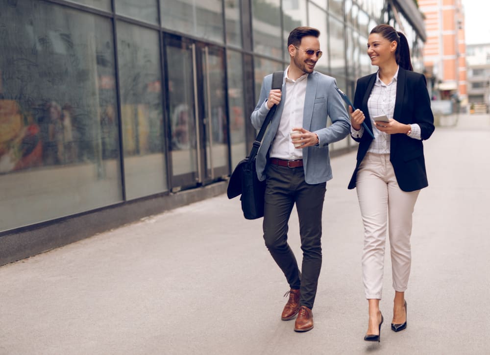 Resident discussing a project with a colleague outside their office near Sofi Belmont Hills in Belmont, California