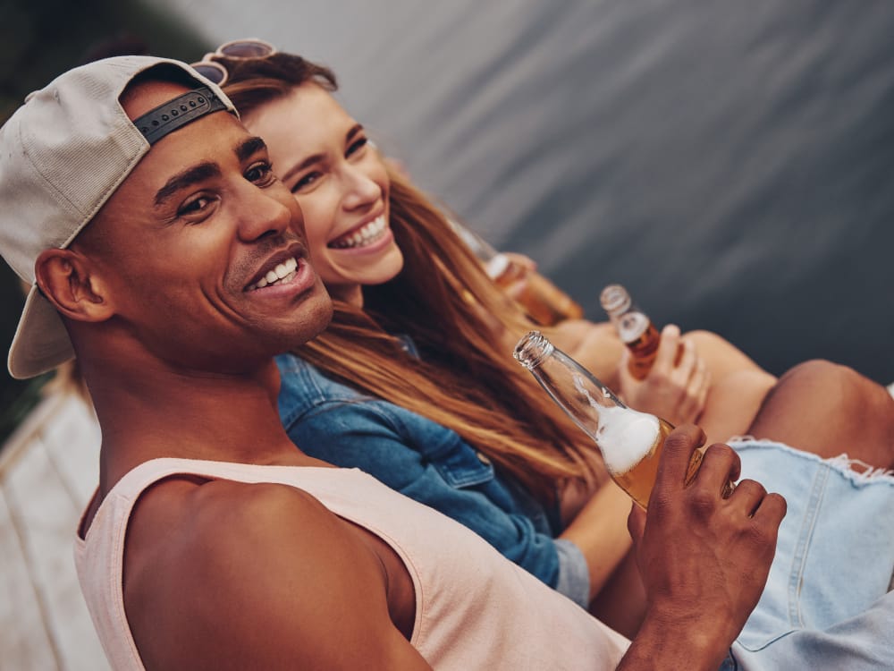 Residents enjoying beverages on a lake at Borrego at Spectrum in Gilbert, Arizona