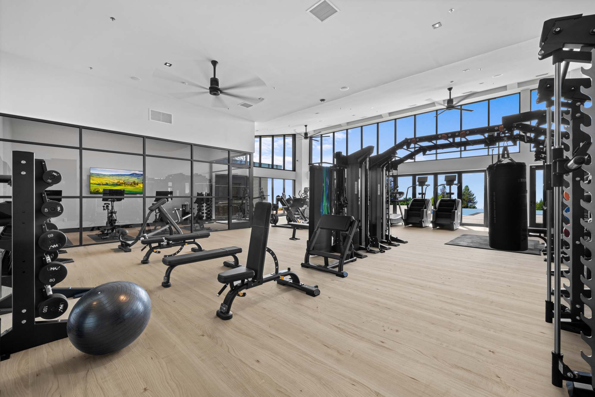 Universal gym with machines, free weights, and cycle room at The Highlands at Silverdale in Silverdale, Washington