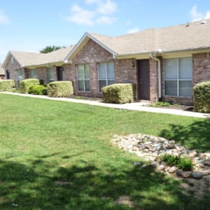 Exterior and front view of the apartments at Sierra Vista Apartments in Midlothian, Texas