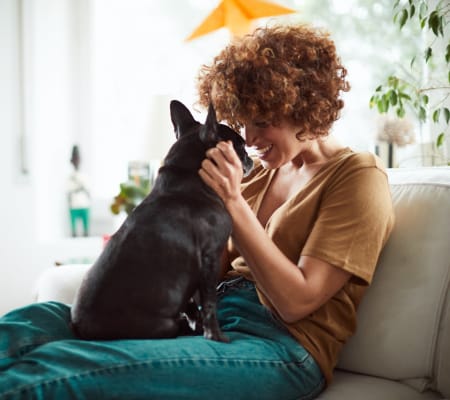 Resident and her dog at Ramblewood Apartment Homes in Fremont, California