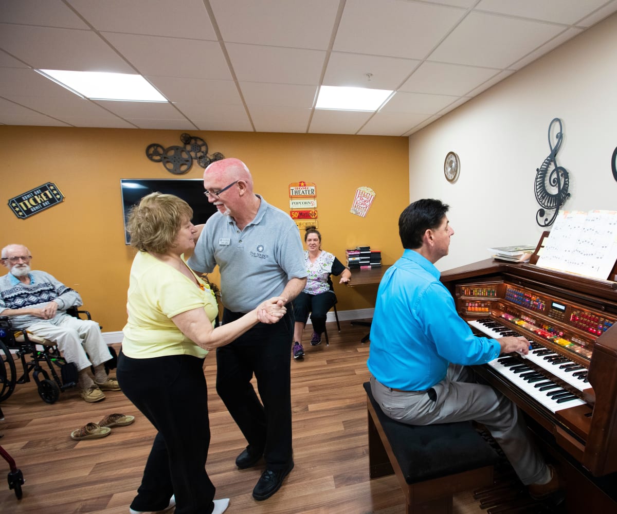 Residents enjoy music and dancing at The Springs At South Biscayne in North Port, Florida.