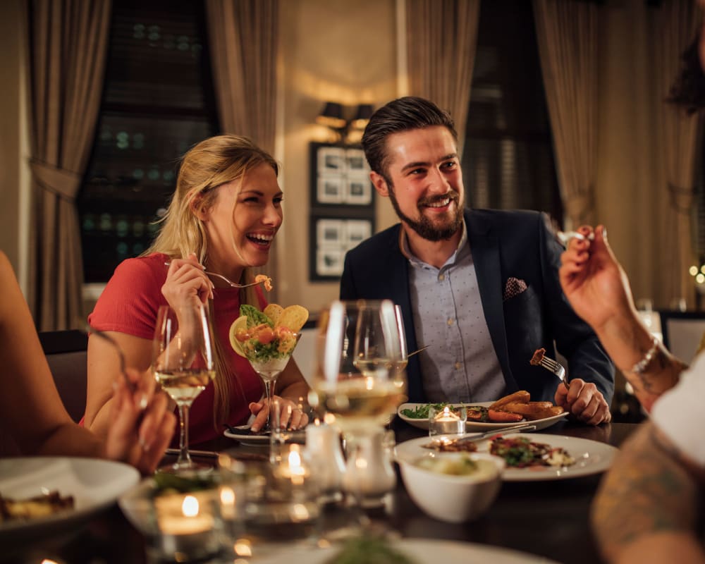 Residents enjoying food and drinks at Gold Seal Lofts in New Orleans, Louisiana