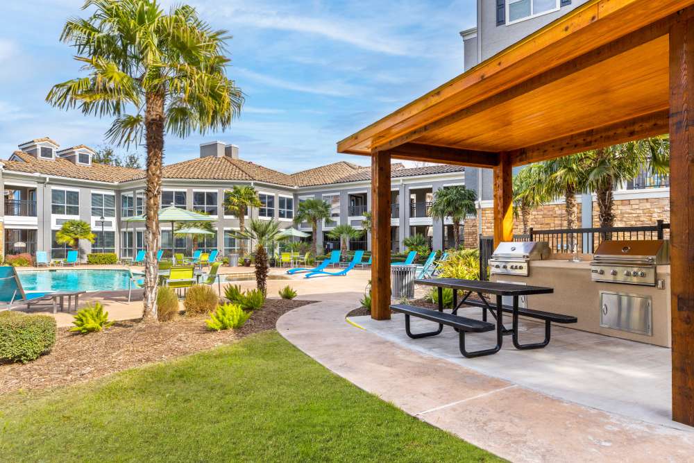 Poolside gazebo with BBQ grills at The Abbey at Grande Oaks in San Antonio, Texas