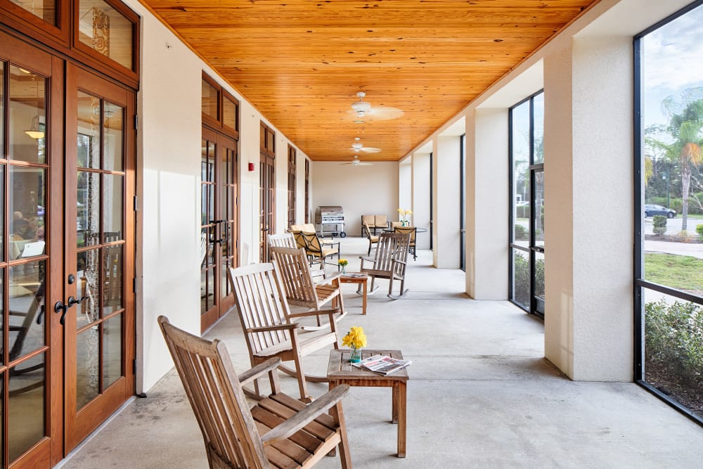 Interior relaxation area with large windows at The Springs At South Biscayne in North Port, Florida. 