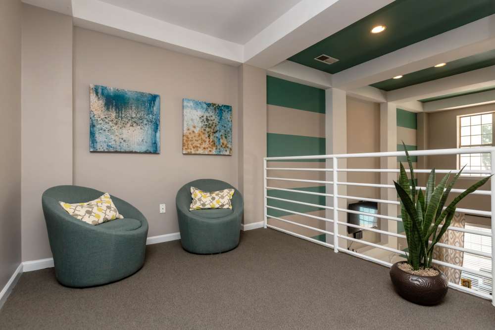 Loft seating area with chairs at Camellia in Raleigh, North Carolina