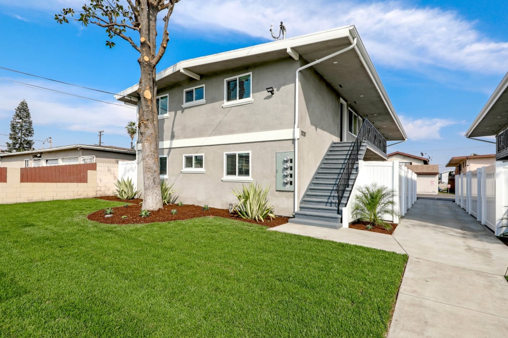 Grass outside an apartment building at Pacific West Villas in Westminster, California