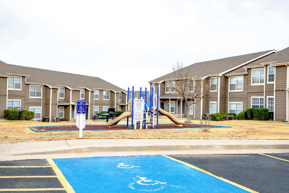 Community playgrounds at Whispering Plains Apartments in Guymon, Oklahoma