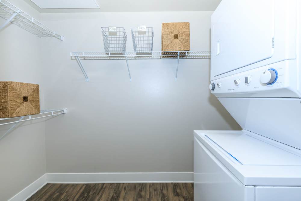 Stoarge area with stackable washer and dryer unit at Park Place Olde Town Apartments in Arvada, Colorado
