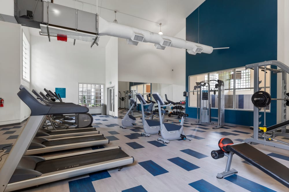 Fitness center with plenty of individual workout stations at Olin Fields Apartments in Everett, Washington
