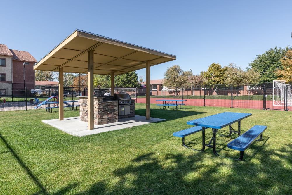 Picnic and barbecue area at Shadowbrook Apartments in West Valley City, Utah
