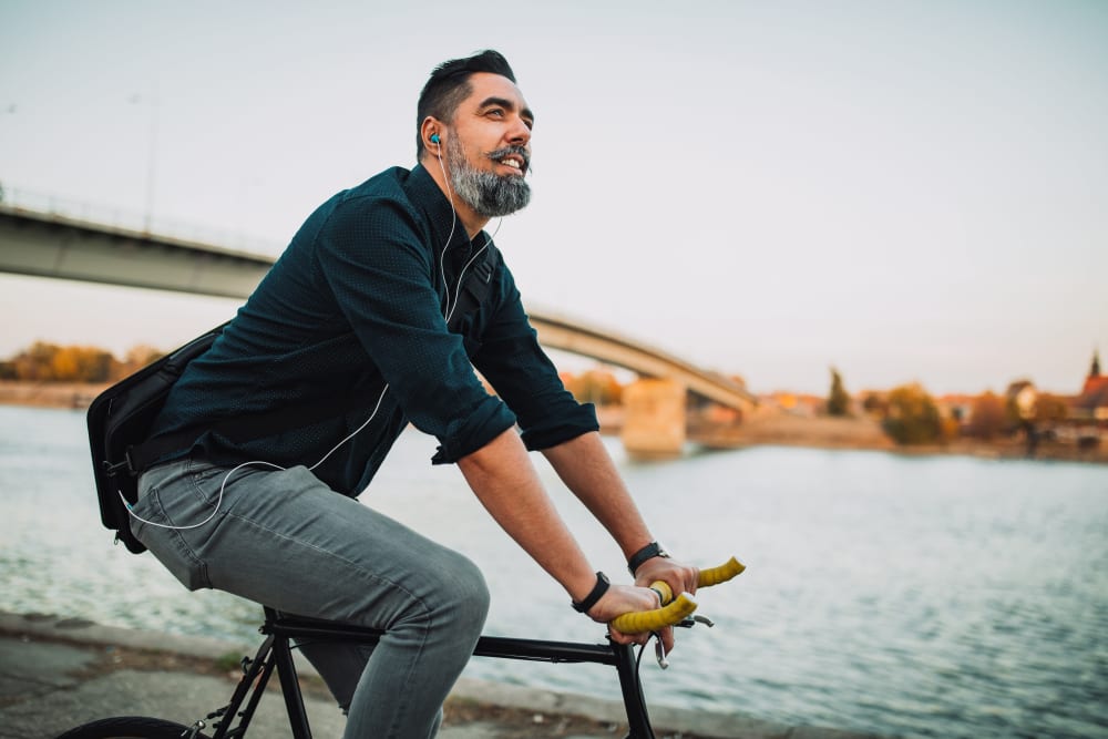 A man on a bike ride near The Columbia at the Waterfront in Vancouver, Washington