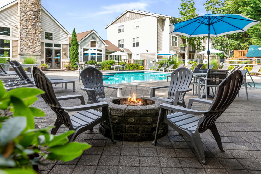 Fire pit near the swimming pool at Wildreed Apartments in Everett, Washington