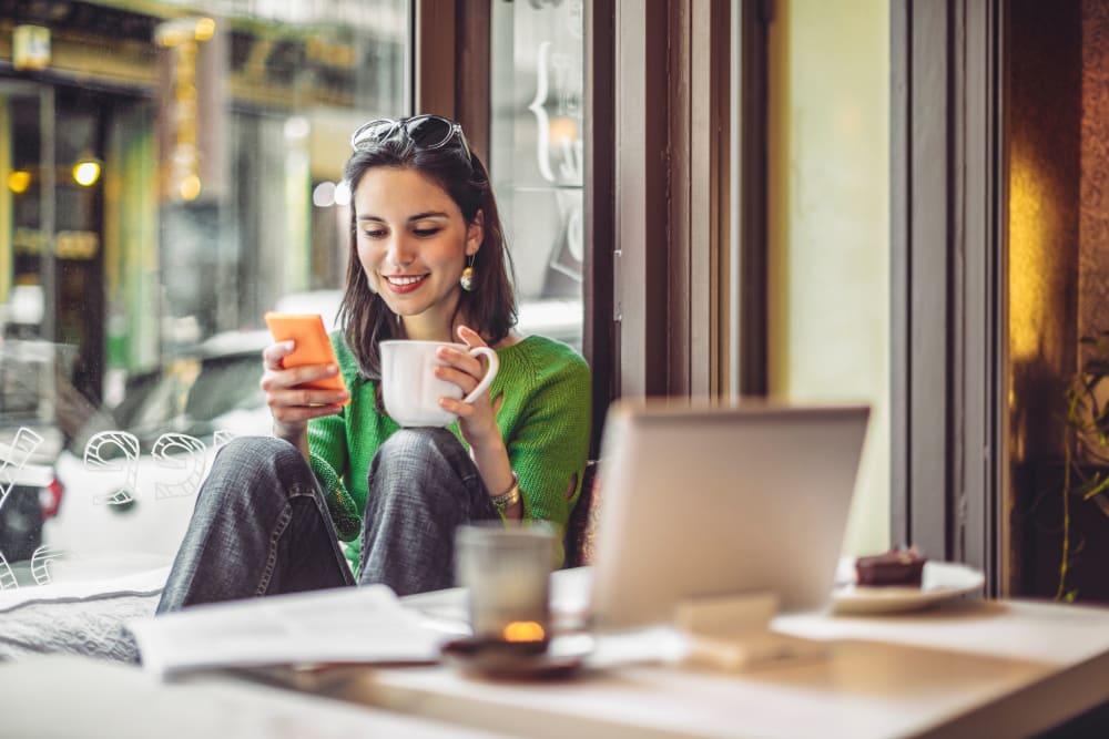 A woman at a coffee shop near Karbon Apartments in Newcastle, Washington