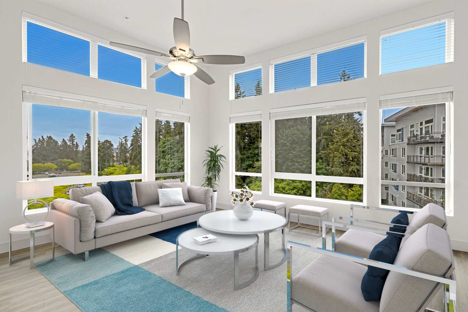Spacious living room with large windows at Radiate in Redmond, Washington 