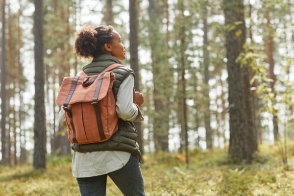 A woman on a hike through the woods near The Lively Indigo Run in Ladson, South Carolina