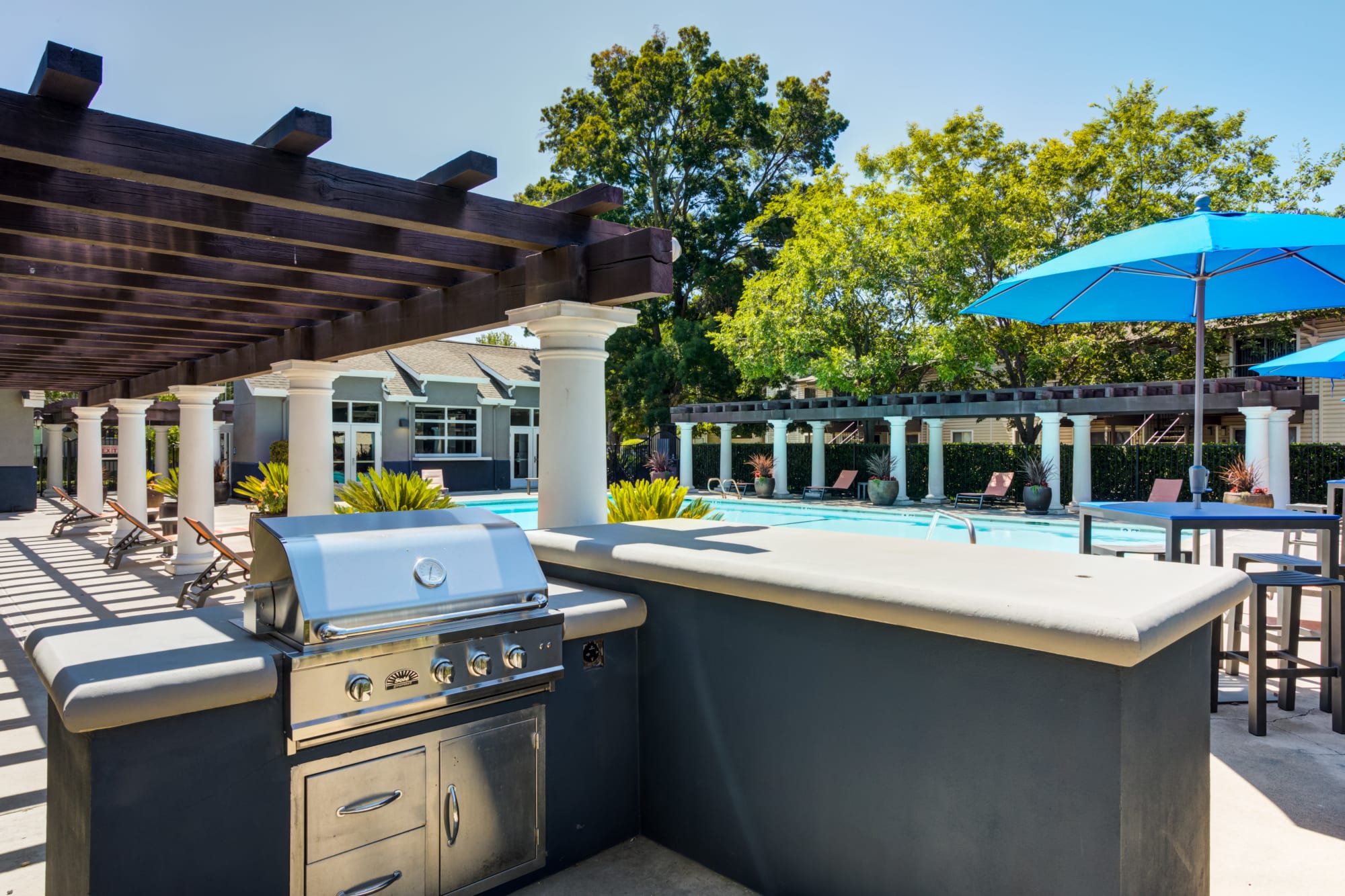 Outdoor grill area at The Woodlands Apartments in Sacramento, California