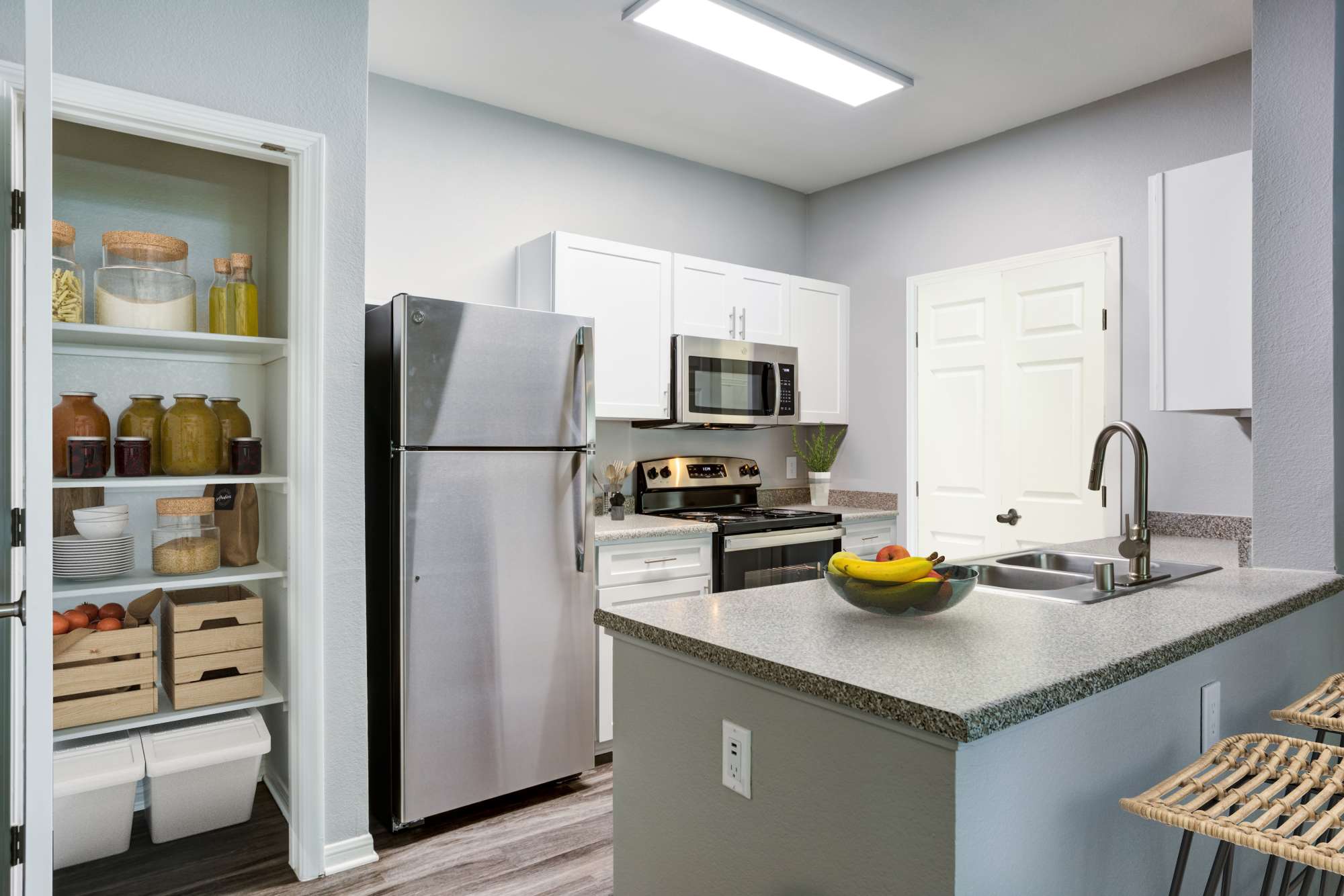 Kitchen with stainless-steel appliances and an island at Miramonte and Trovas in Sacramento, California
