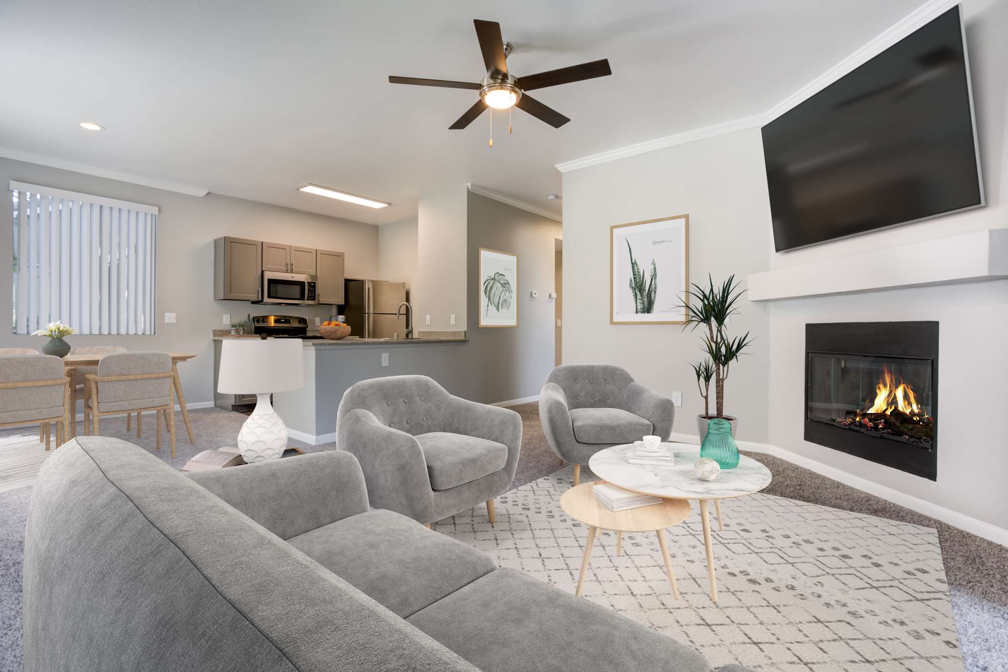 Luxurious living room with tv, fire place with access to open kitchen and dining area at Miramonte and Trovas in Sacramento, California
