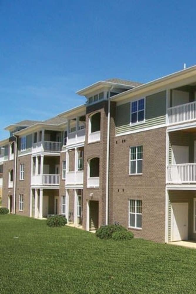 Resident private balcony with furnishings at Oak Grove Crossing Apartments in Newburgh, Indiana