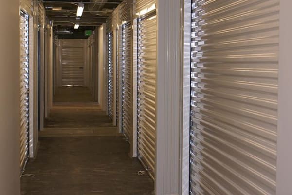 A hallway of indoor storage units at Towne Storage - Gateway in Salt Lake City, Utah