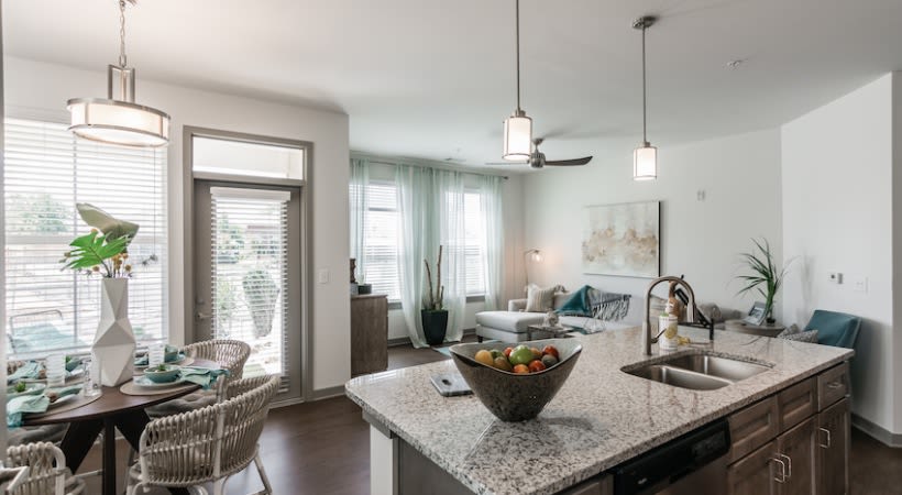 Dining and Living room area with island countertop at The Banks at West Fork in Murfreesboro, Tennessee