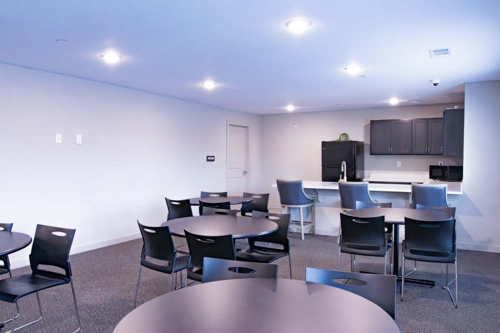 Community kitchen and dining area at Villas At Mount Zion in Stockbridge, Georgia