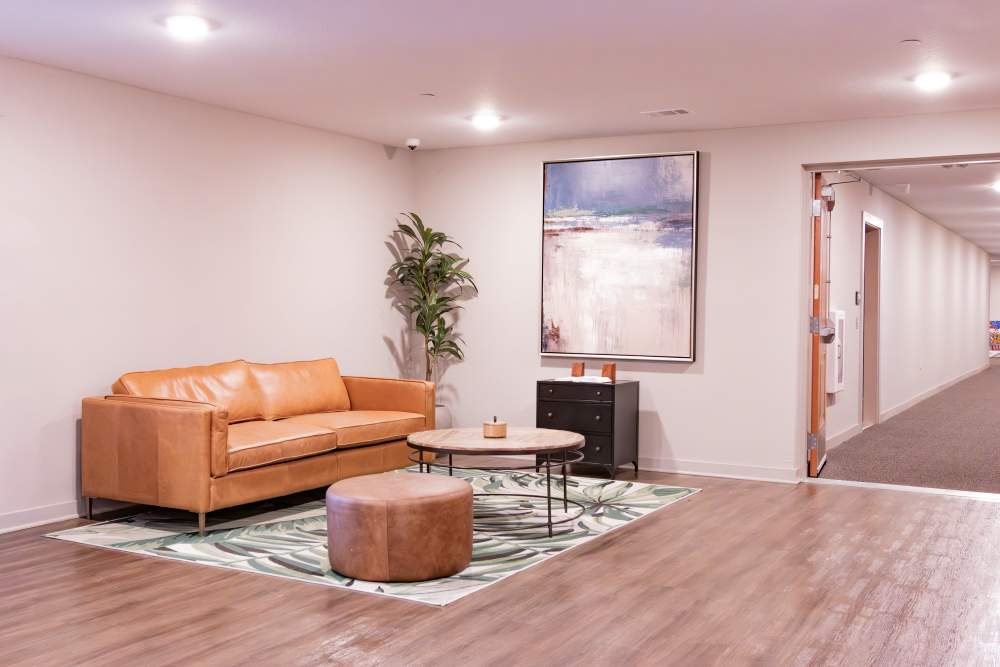 Lobby area with large couch at Villas At Mount Zion in Stockbridge, Georgia