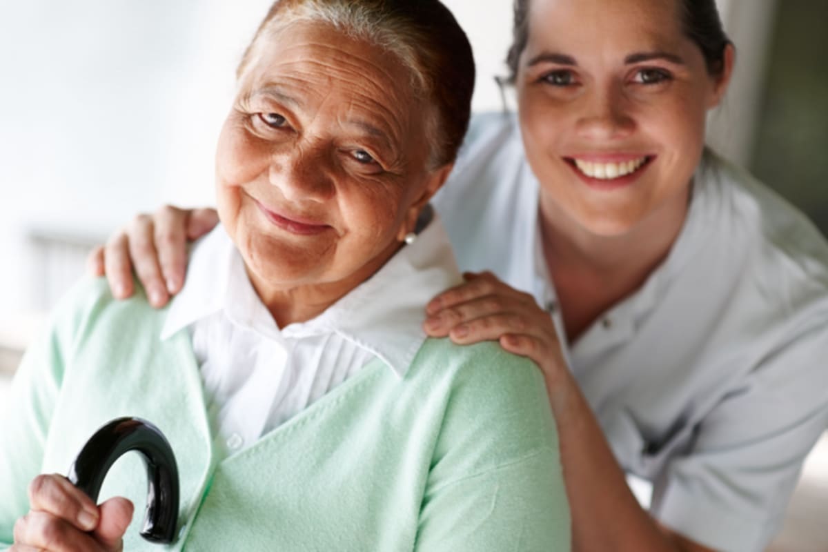 A resident and smiling caretaker at Brightwater Senior Living of Linden Ridge in Winnipeg, Manitoba