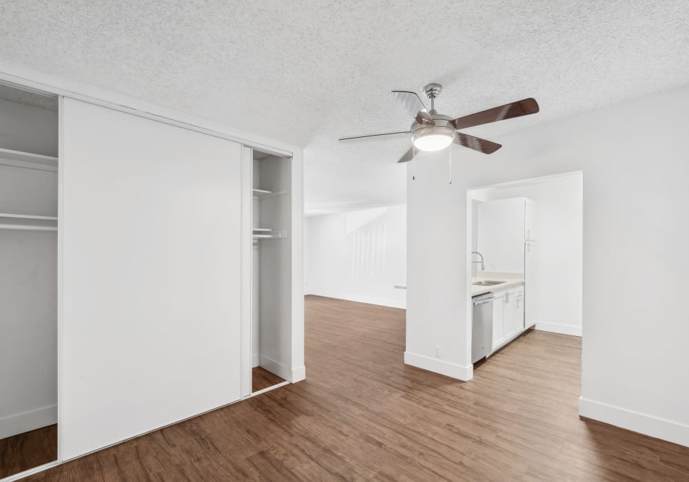 Bedroom with ceiling fan and large closets at The Ralston at Belmont Hills in Belmont, California