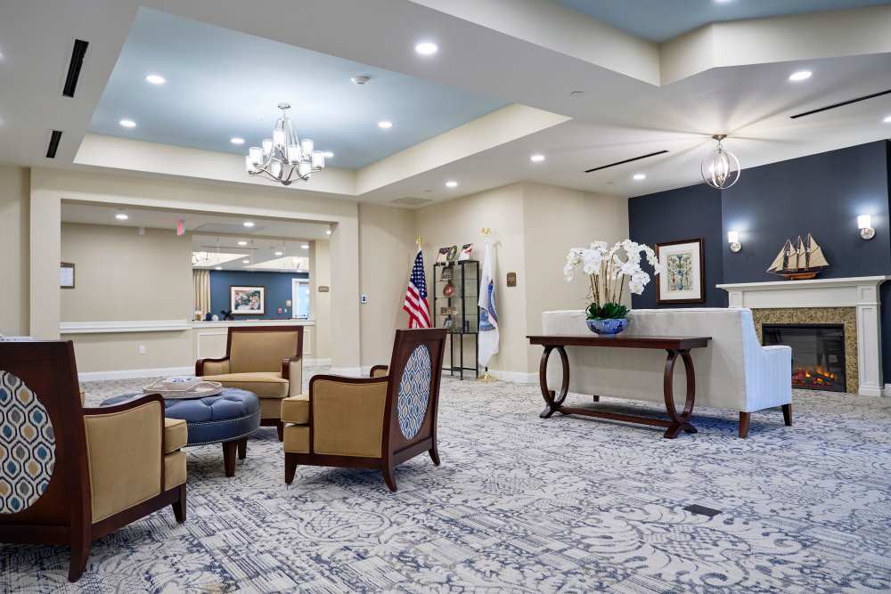 Spacious indoor common area with fireplace at Harmony at Waldorf in Waldorf, Maryland