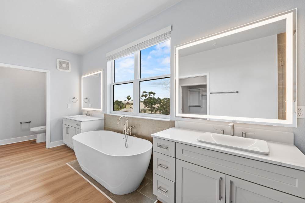 Modern bathroom with freestanding tub at Coconut Pointe in Estero, Florida