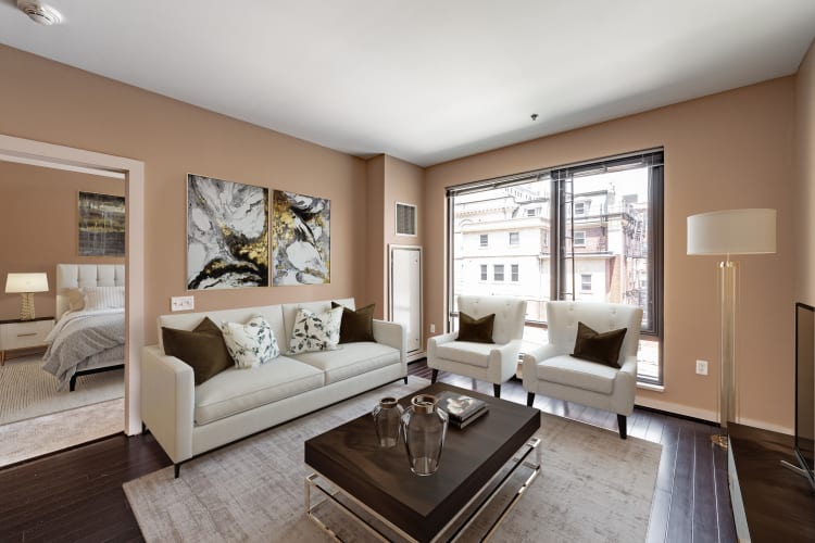 Spacious, well-lit living room with wood flooring at Front Street Lofts in Hartford, Connecticut