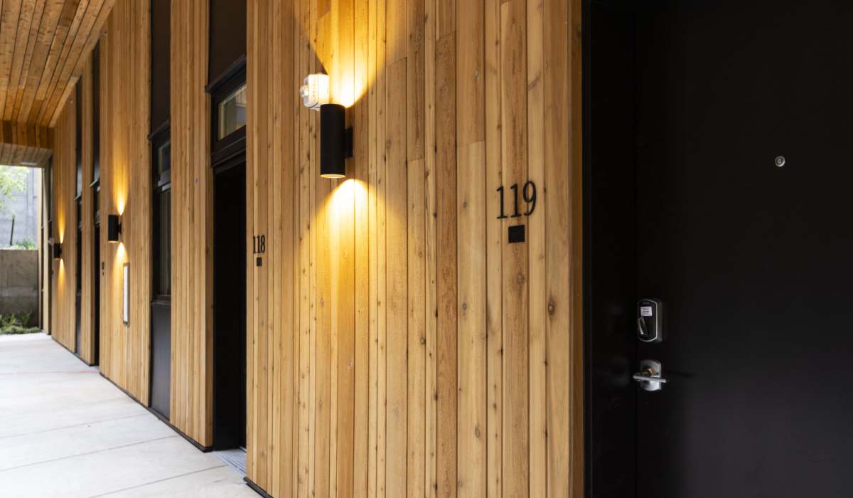 Apartment entry hallway with wood-paneled exterior at Brookland Apartments in Portland, Oregon