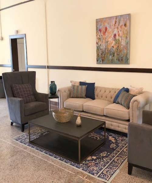 Community room with seating space at Lincoln House in Owosso, Michigan