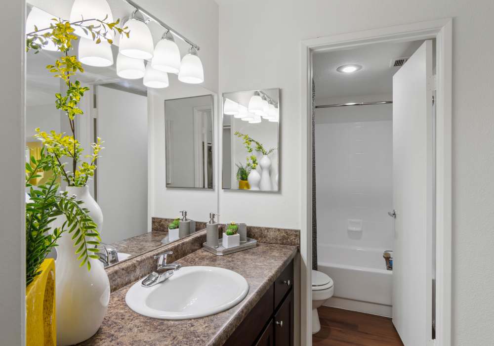 Bathroom with vanity and large tub at Cabrillo Apartments in Scottsdale, Arizona