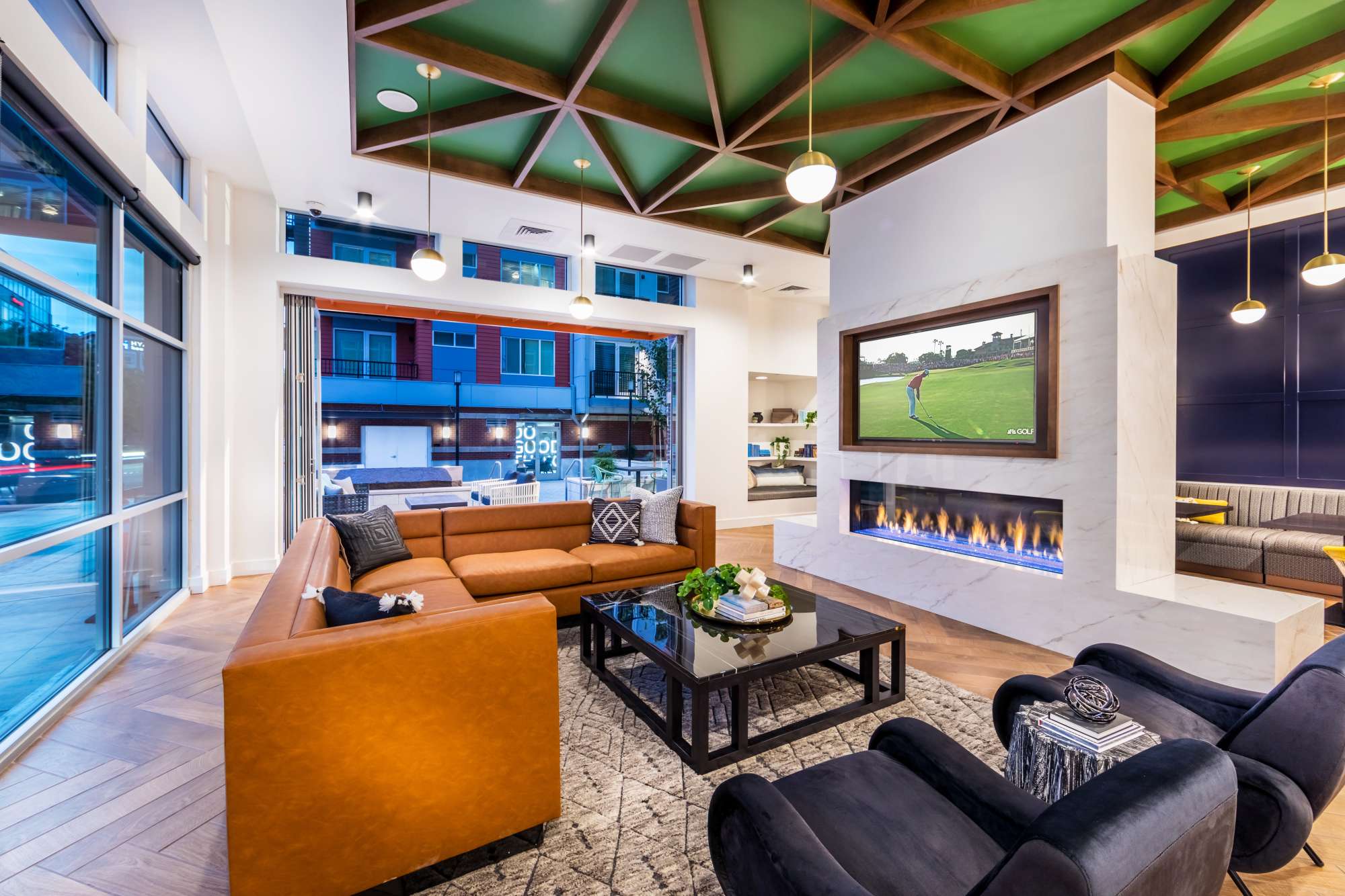 Modern-style lounge area with fireplace and couch at Radiate in Redmond, Washington