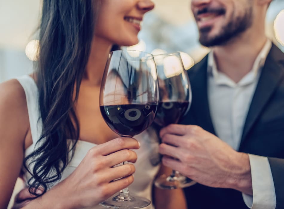 Couple raising their glasses in their new home at Sofi Waterford Park in San Jose, California