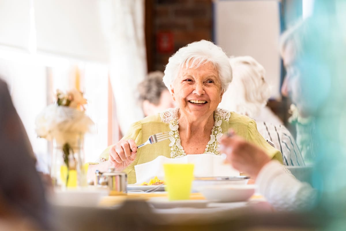 Resident having a meal at Beach House Assisted Living & Memory Care in Naples, Florida