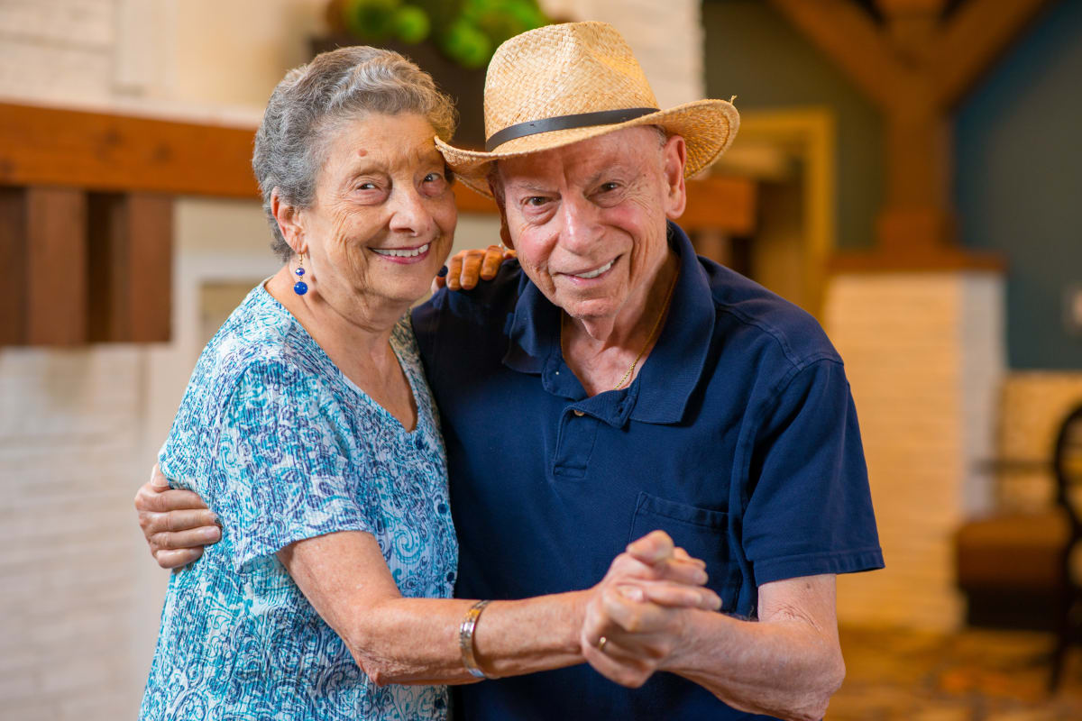 Residents dancing together an at Integrated Senior Lifestyles community