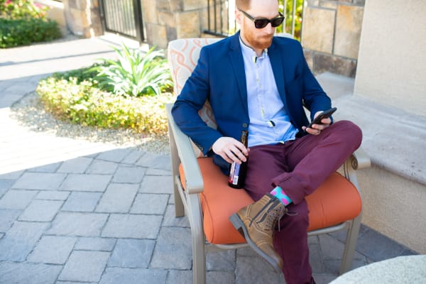 Resident relaxing at one of the many outdoor common areas at San Marquis in Tempe, Arizona
