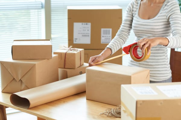 A family packing boxes at Store It All Self Storage - Baltimore in Baltimore, Maryland