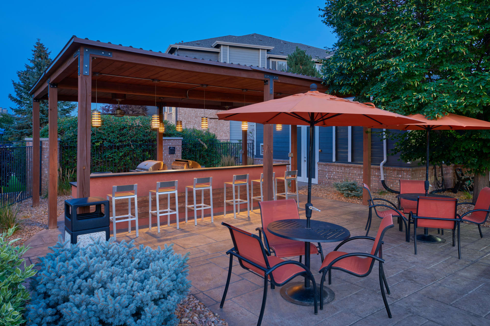 The poolside BBQ, perfect for entertaining friends, at Hawthorne Hill Apartments in Thornton, Colorado