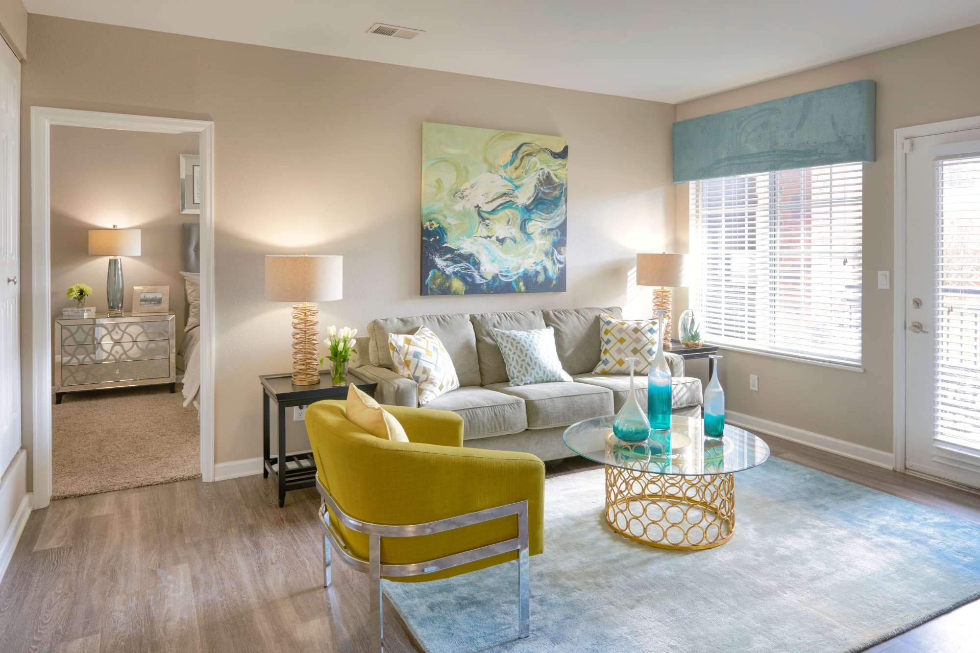 Kitchen and living room with fireplace at Villas at Homestead Apartments in Englewood, Colorado