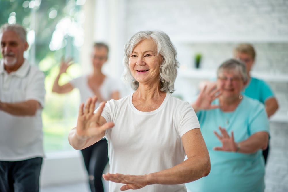 A resident in a wellness class at CERTUS Premier Memory Care Living.