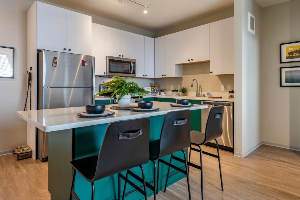 Spacious kitchen with stainless steel appliances at UNCOMMON Dinkytown in Minneapolis, Minnesota